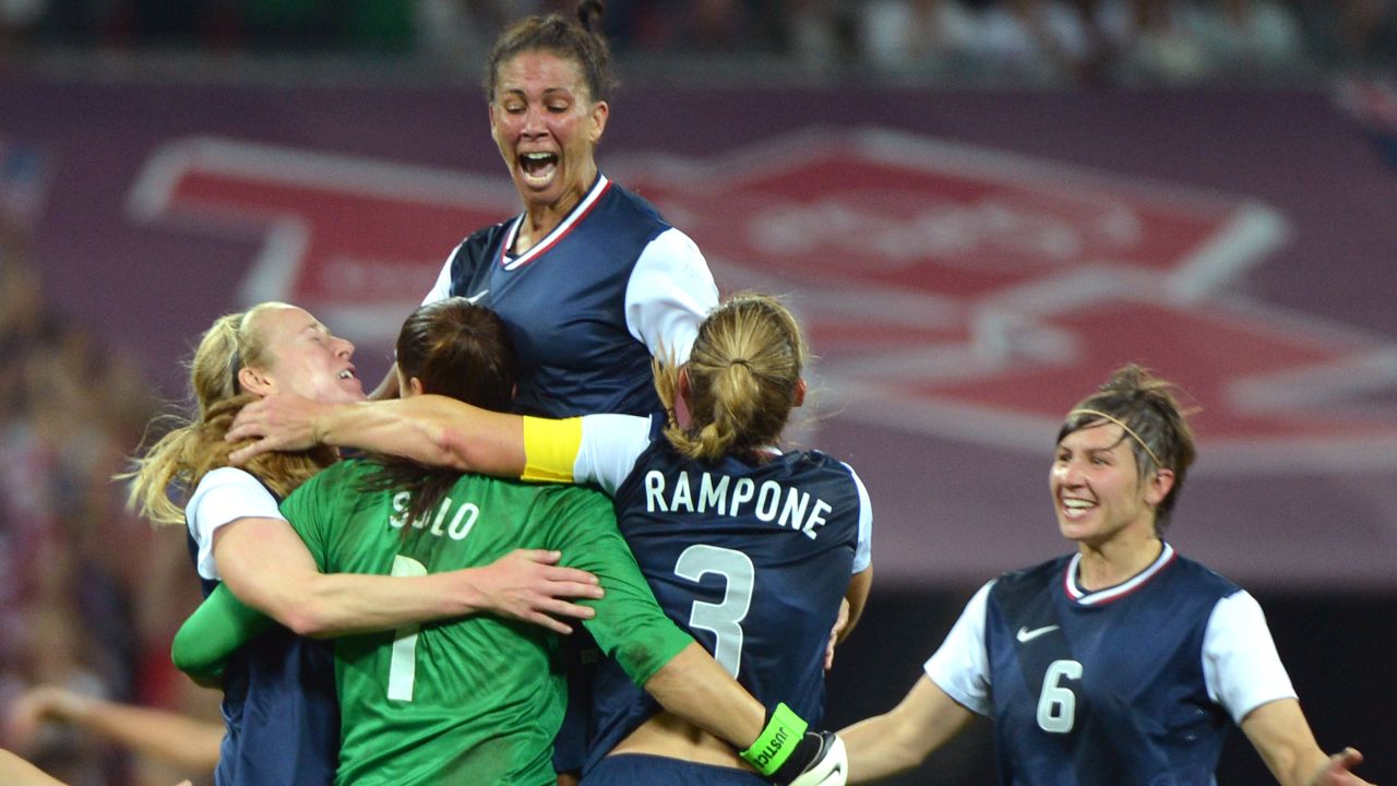 Midfielder Shannon Boxx, top, celebrates with teammates winning gold against Japan on August 9, 2012, in London.