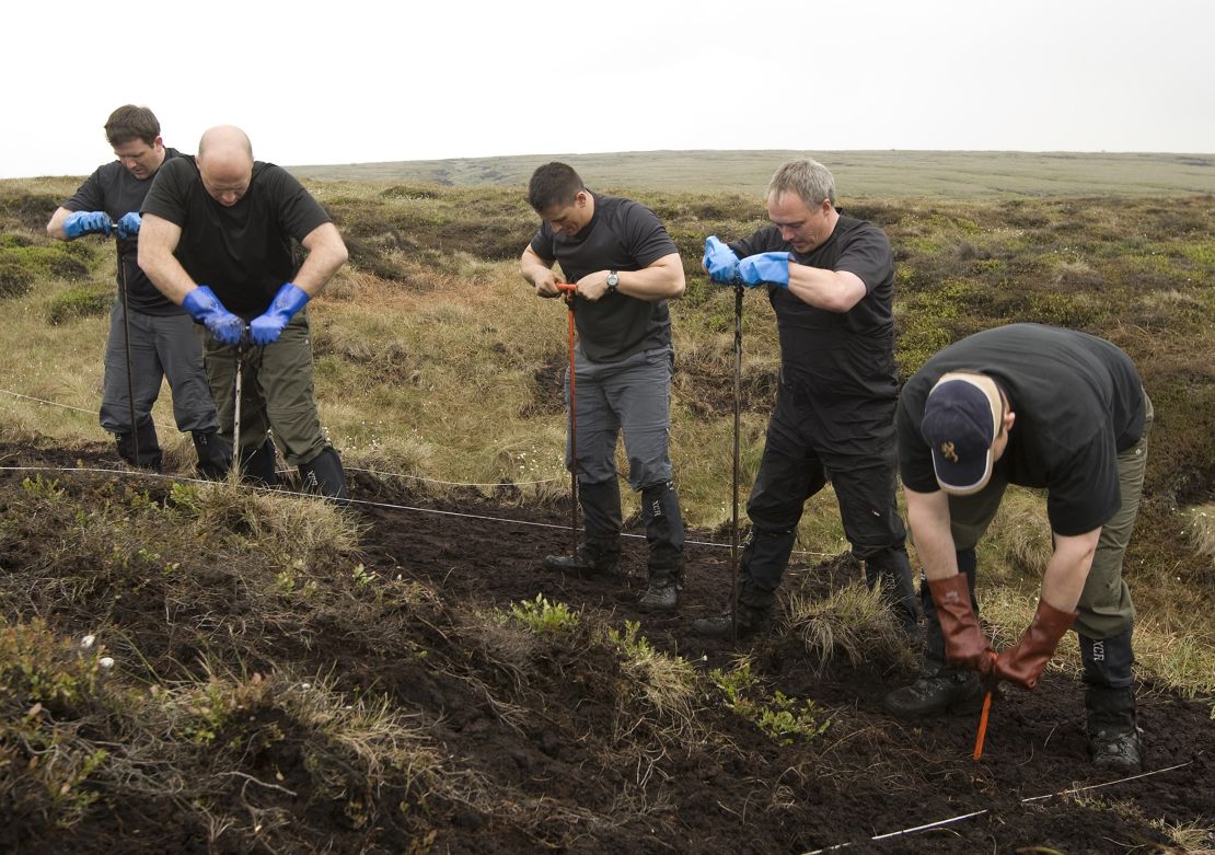 A police search team looks for the body of Moors murder victim Keith Bennett on Saddleworth Moor.
