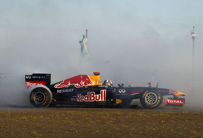 Coulthard burns rubber, while the Statue of Liberty can be seen poking through the thick cloud of smoke.