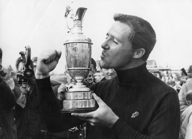 Player kisses the British Open trophy, which he won for the second time at Carnoustie, Scotland in 1968.