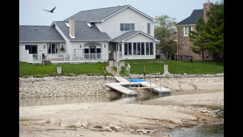 A boat dock is left high and dry at the Morse Reservoir in Noblesville, Indiana, on August 16, where water depths are significantly lower than average because of a widespread drought.