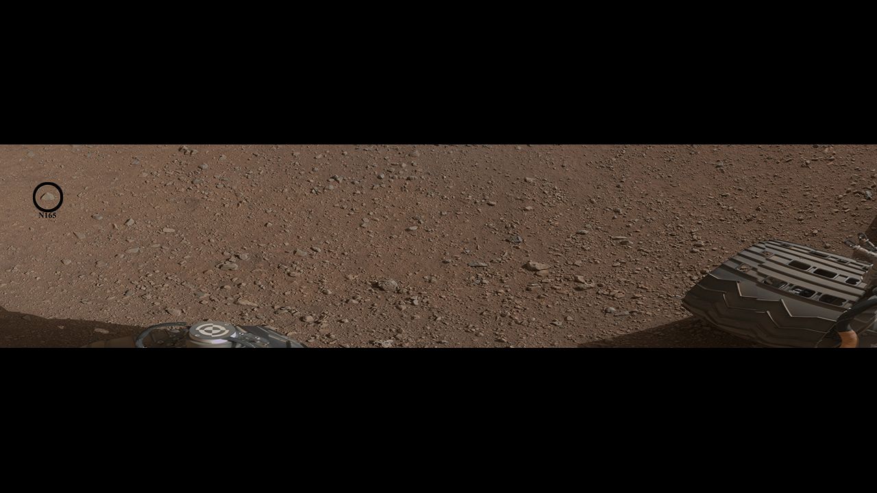 This image shows what will be the rover's first target with it's chemistry and camera (ChemCam) instrument. The ChemCam will fire a laser at the rock, indicated by the black circle. The laser will cause the rock to emit plasma, a glowing, ionized gas. The rover will then analyze the plasma to determine the chemical composition of the rock.  