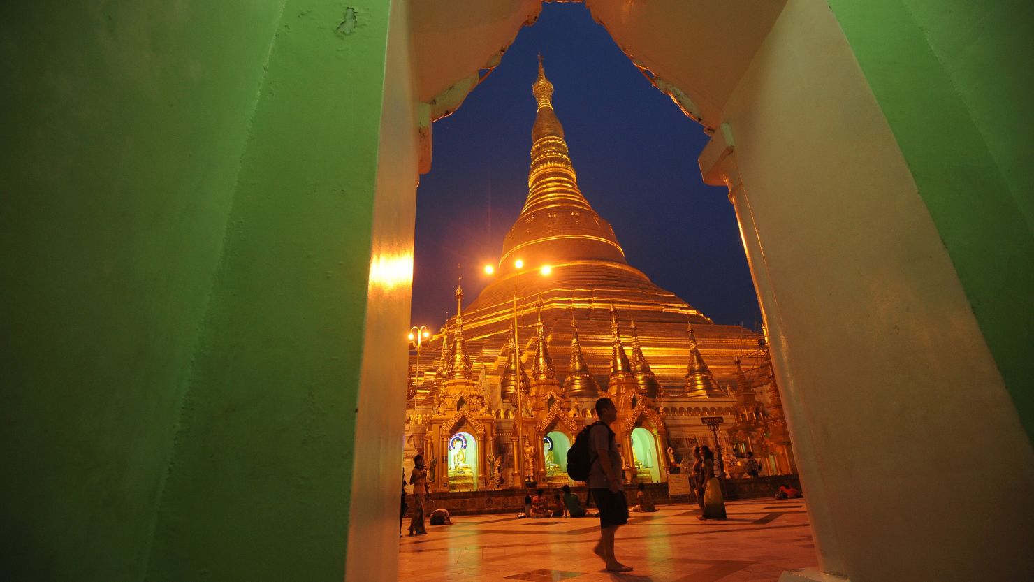 This pcture taken on June 1, 2012 shows a tourist visiting the Shwedagon Pagoda in Yangon. 
