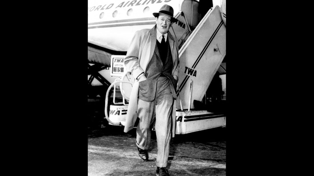 A well-turned out John Wayne ambles away from a TWA flight at Midway in the '50s.