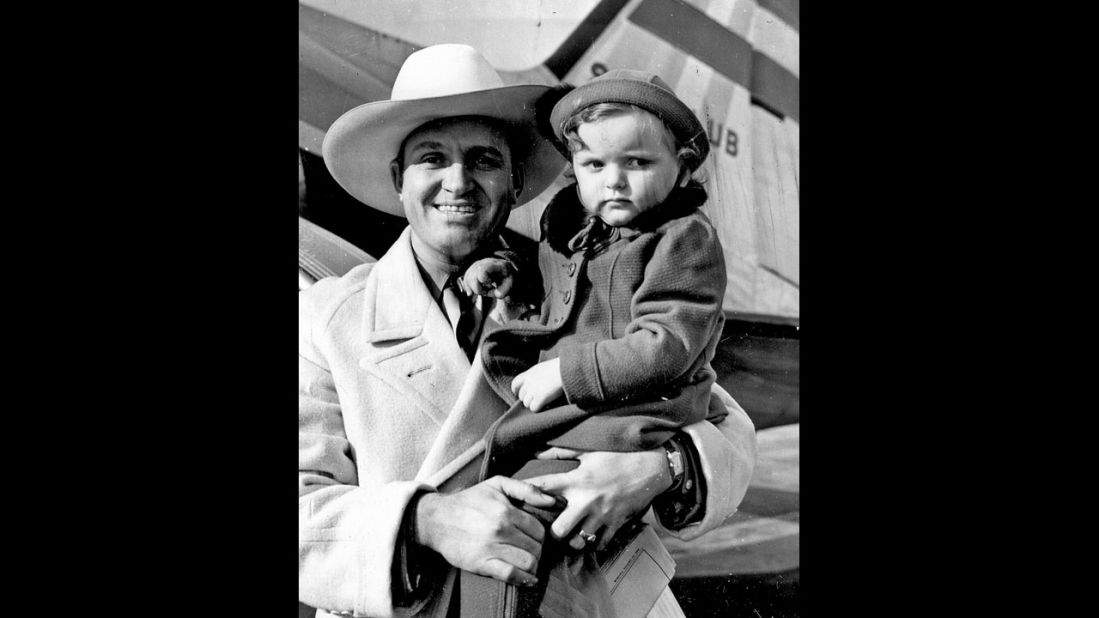 Gene Autry holds Rotunno's daughter Judy, 1930s.