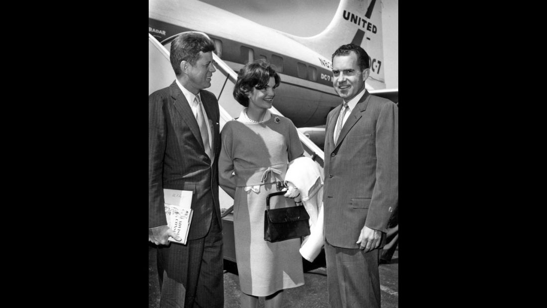 Sen. John F. Kennedy, Jaqueline Kennedy and Richard Nixon on the tarmac in 1959.