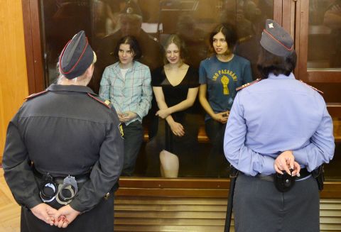 Pussy Riot band members Yekaterina Samutsevich, Maria Alyokhina and Nadezhda Tolokonnikova sit in a glass-walled cage during a court hearing in Moscow on Friday August 17.