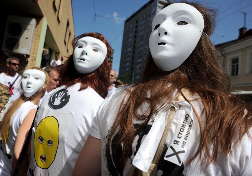 Demonstrators wear Pussy Riot-style masks outside a Moscow court. Singer Madonna also donned one of the masks during a recent gig in the city, telling the audience: "Everyone has the right to free speech, everywhere in the world. Maria, Katya, Nadia, I pray for you."