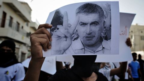 A Bahraini Shiite Muslim youth holds a picture of prominent rights activist Nabeel Rajab during a demonstration on June 11.