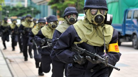 South Korean police in gas masks take part in a drill Saturday in Seoul as part of joint U.S.-South Korean military exercises.