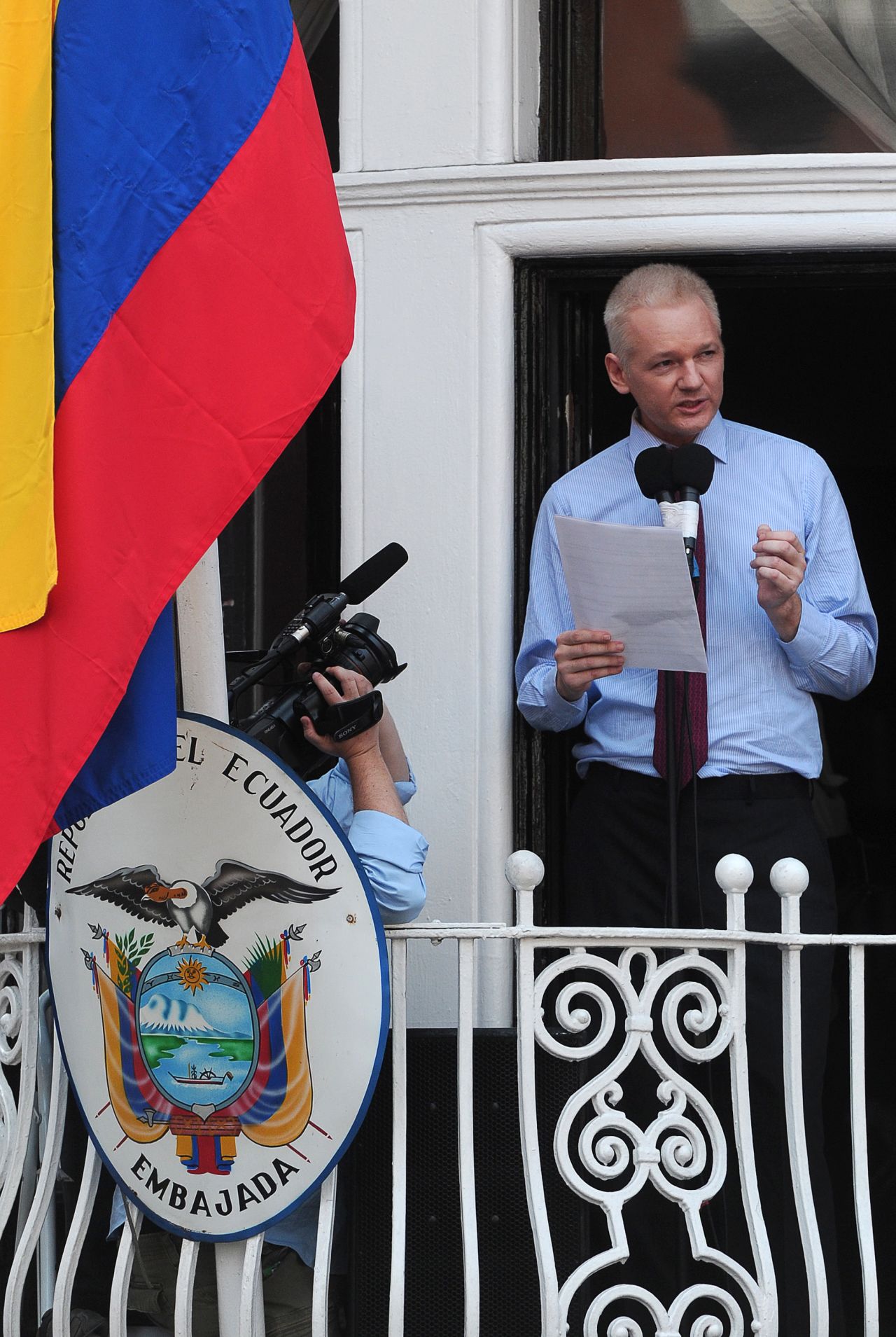 Assange addresses the media and his supporters from the balcony of the Ecuadorian Embassy in London on Sunday, August 19.