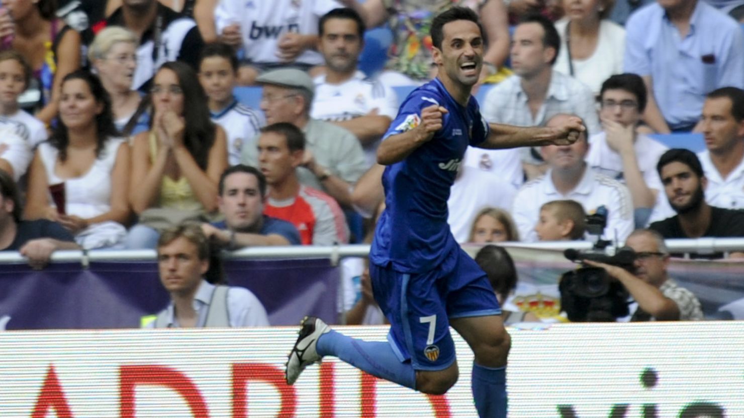 Valencia's Brazilian midfielder Jonas celebrates his equalizing goal in the Santiago Bernabeu Stadium.  