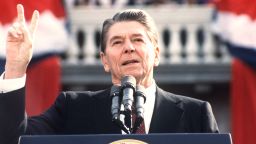 US President and Republican presidential candidate Ronald Reagan makes the V sign as he addresses supporters at an electoral meeting in November 1984, a few days before the american presidential election. (Photo credit should read DON RYPKA/AFP/Getty Images) 