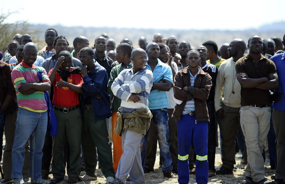 Striking workers gather on August 20 at the Lonmin-owned platinum mine in Marikana, 10 days after 3,000 miners began an illegal strike over pay.