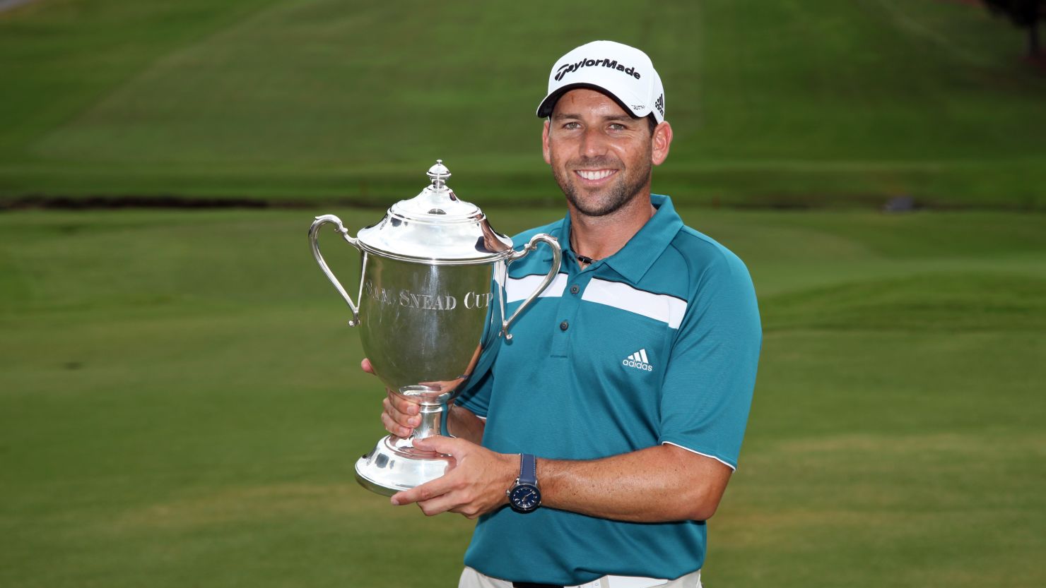 Sergio Garcia takes hold of the Sam Snead Cup following his first win at a PGA Tour event since 2008.