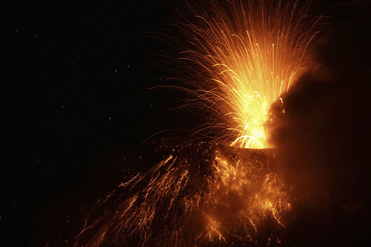 Lava, ash and other volcanic material flows from Tungurahua on Tuesday. Tungurahua means "throat of fire" in the native Quechua language of the Andes.
