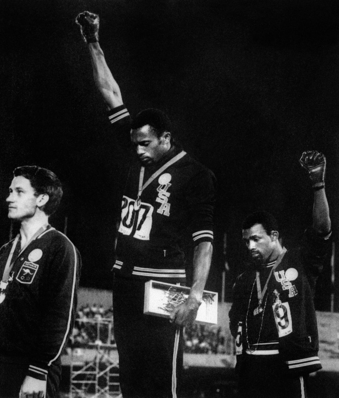 Australian Peter Norman (left) stands alongside U.S. athletes Tommie Smith (C) and John Carlos (R) at the 1968 Olympic Games.