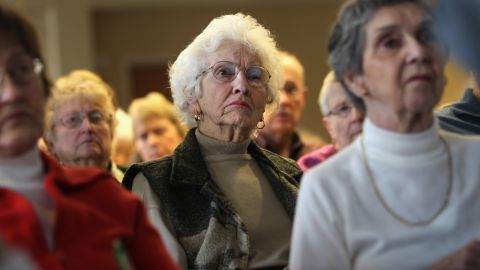 Seniors attend a "Medicare Monday" seminar in Colorado. Amitai Etzioni says curbing health care costs will curb Medicare costs.