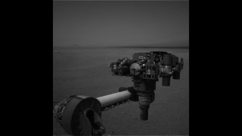 Curiosity moved its robot arm on August 20, 2012, for the first time since it landed on Mars. "It worked just as we planned," said JPL engineer Louise Jandura in a NASA press release. This picture shows the 7-foot-long arm holding a camera, a drill, a spectrometer, a scoop and other tools. The arm will undergo weeks of tests before it starts digging.