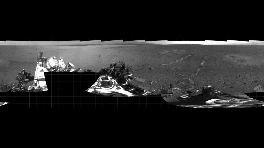 The Mars rover Curiosity moved about 15 feet forward and then reversed about 8 feet during its first test drive on August 22, 2012. The rover's tracks can be seen in the right portion of this panorama taken by the rover's navigation camera.  