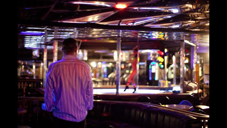 Joe Redner watches a dancer perform at his club, Mons Venus.