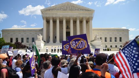 Protesters shout slogans during a protest against Arizona's immigration law outside of the U.S. Supreme Court in April. 