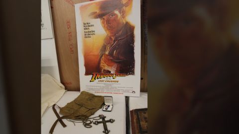 Props from the opening sequence of "Indiana Jones and the Last Crusade" -- young Indy's Boy Scout backpack, Eagle Scout ribbon and the Spanish crucifix he encounters ("It belongs in a museum!!")