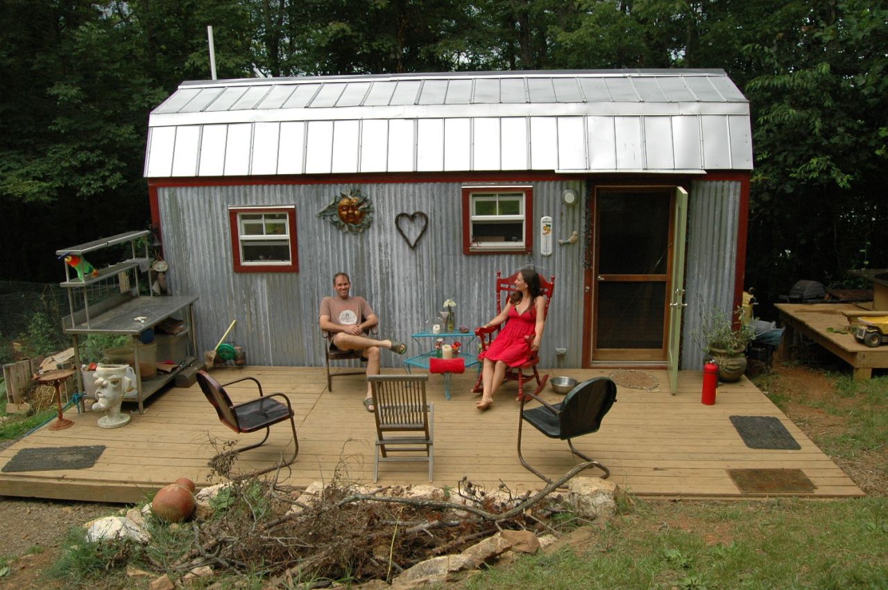 Downsizing from a 1,500-square-foot house to a tiny 168-square-foot dwelling in Floyd, Virginia, Hari Berzins says she loves the freedom when it comes to tiny living. "We live larger on our 3-acre hillside," she said. "We have more time to enjoy each other, tend to our large garden and cultivate a supportive community."