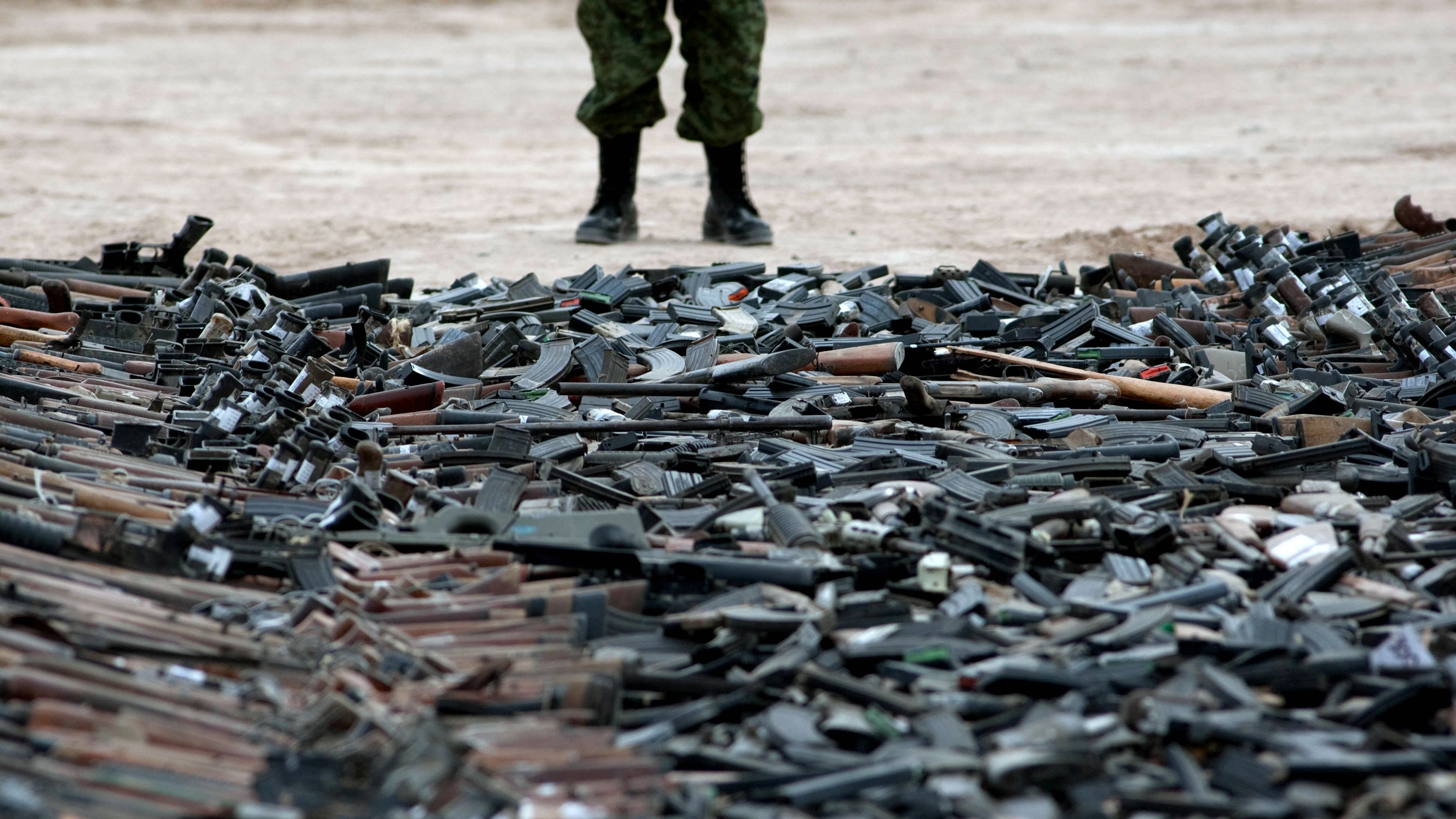 Thousands of guns lie on the ground before their destruction in Ciudad Juarez, Mexico, in February.
