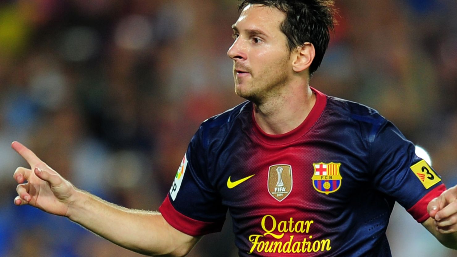 Lionel Messi celebrates scoring from the penalty spot in Barcelona's 3-2 Spanish Super Cup win over Real Madrid.