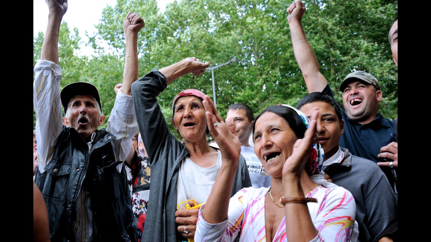 Roma take part in a demonstration Wednesday, August 22, in front of City Hall in Roubaix, northern France. 