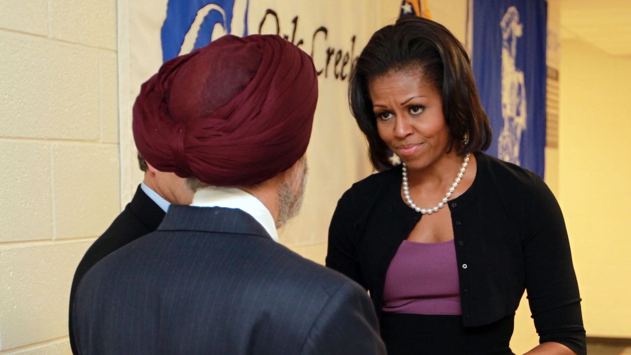 Michelle Obama greets Sikh community representative Dr. Kulwant Singh Dhaliwal on Thursday in Oak Creek, Wisconsin.