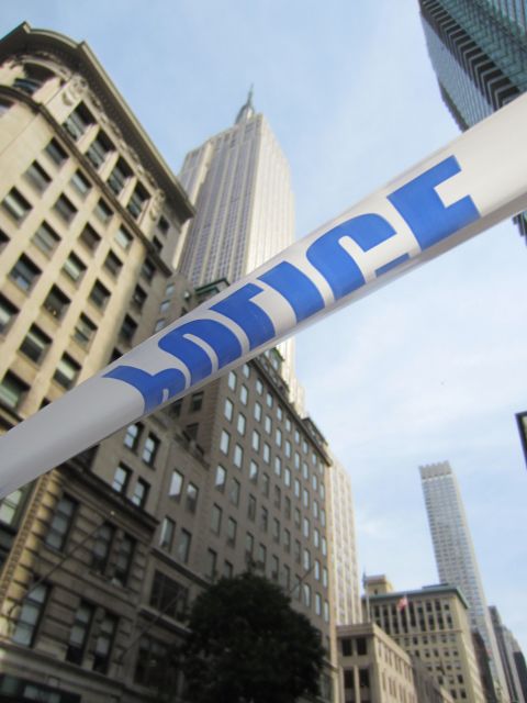 Police tape marks off the scene of Friday's shooting outside the Empire State Building.