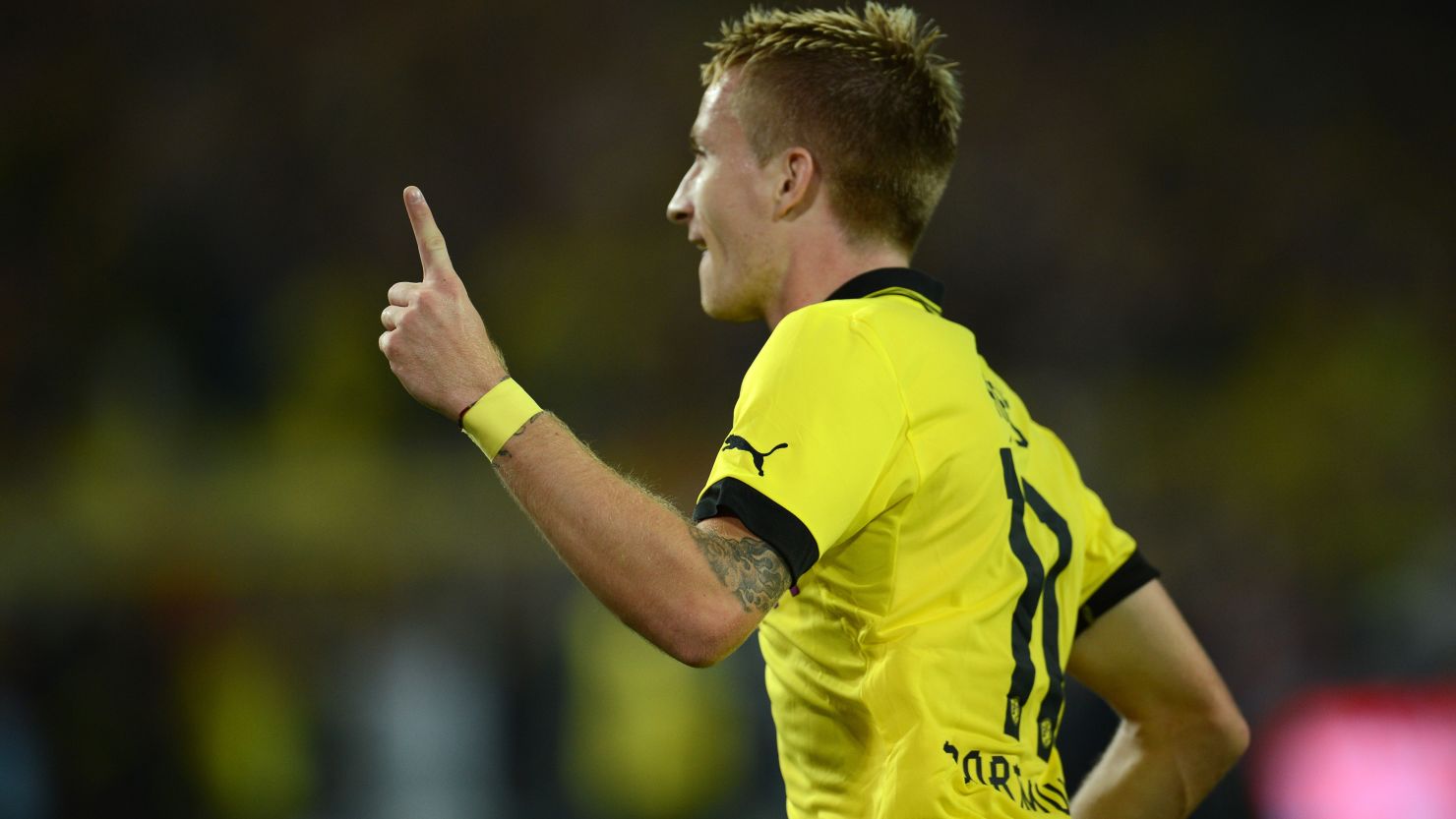 Marco Reus celebrates Borussia Dortmund's opening goal in a 2-1 win over Werder Bremen at the Westfalenstadion on Friday