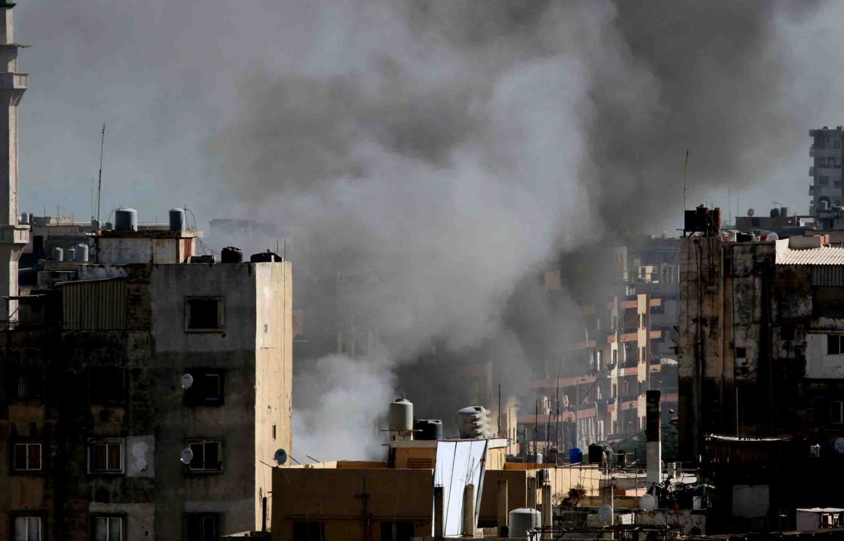 Smoke billows from a building in Tripoli, Lebanon.