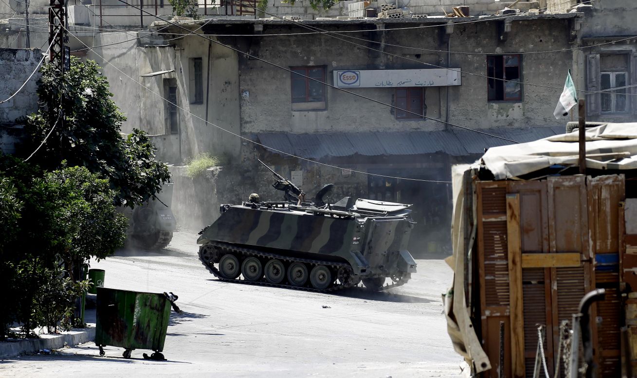 Lebanese army commandos drive an armored personnel carrier in the Bab al-Tabbaneh neighborhood. 