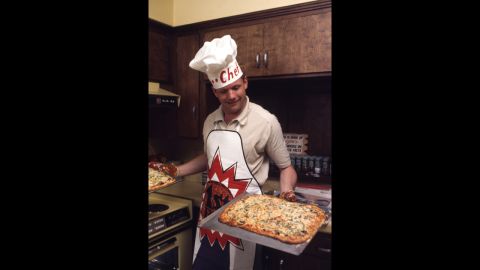 Armstrong presents a pair of pizzas in his kitchen in Houston, Texas, on March 1, 1969.