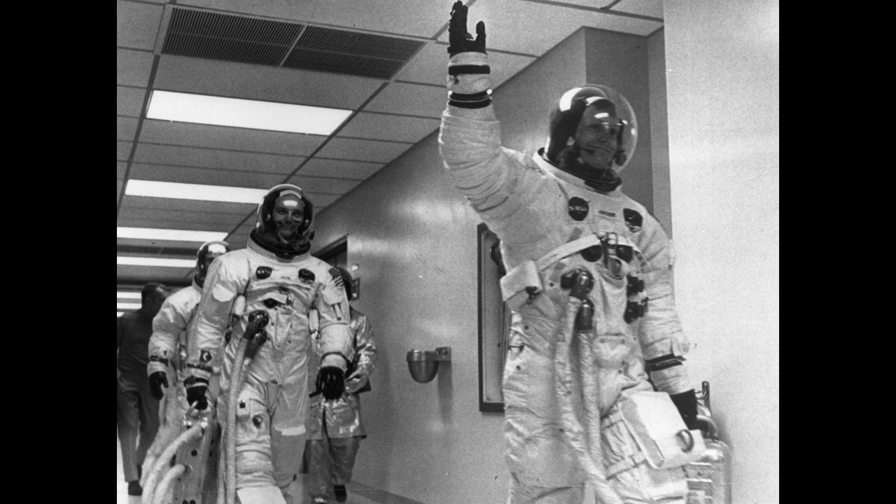 Armstrong leads crew mates Edwin 'Buzz' Aldrin and Michael Collins out of the space center on the Apollo 11 space mission to the moon.