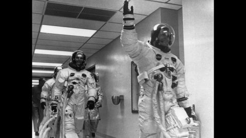 Armstrong leads crew mates Edwin 'Buzz' Aldrin and Michael Collins out of the space center on the Apollo 11 space mission to the moon.  