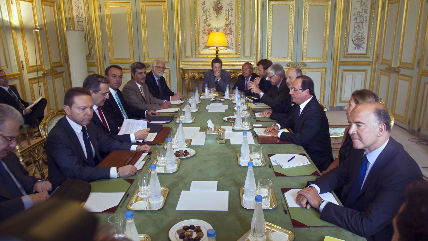 Francois Hollande (3rd right) meets Greek PM Antonis Samaras (3rd left) in Paris on Saturday.