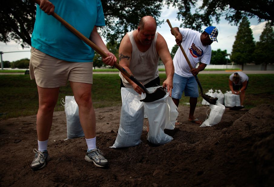 Tampa, Florida, area residents make preparations for the arrival of Tropical Storm Isaac by filling sandbags at a Hillsborough County Public Works Service Center on Saturday.
