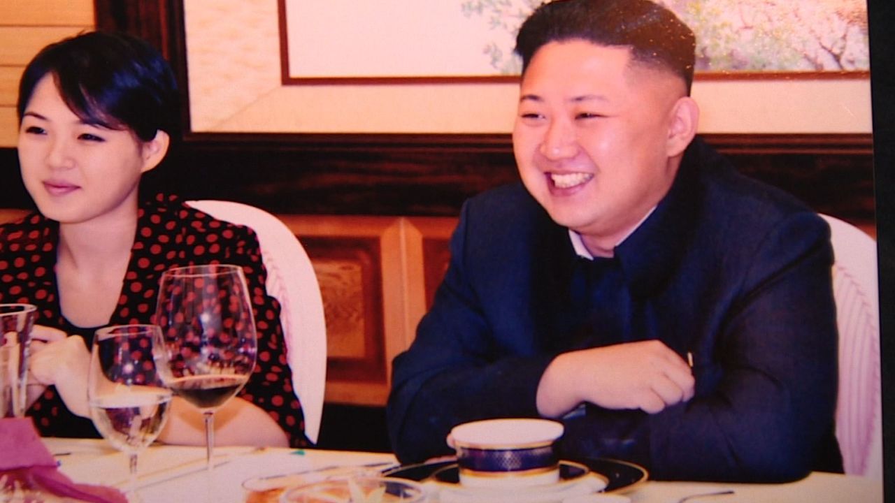 North Korean leader Kim Jong Un and his wife, Ri Sol-ju, are pictured at a party in July.