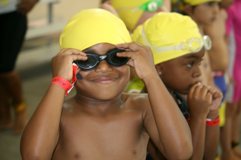 Lincoln Fletcher, 5, tightens his goggles before jumping in the pool. 