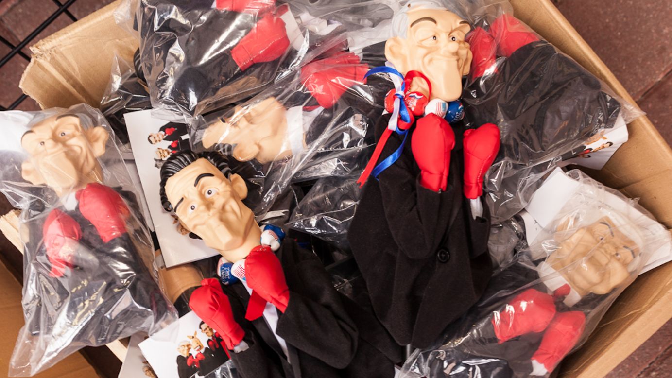 Hand puppets of Mitt Romney, Newt Gingrich and Ron Paul are for sale in Tampa.