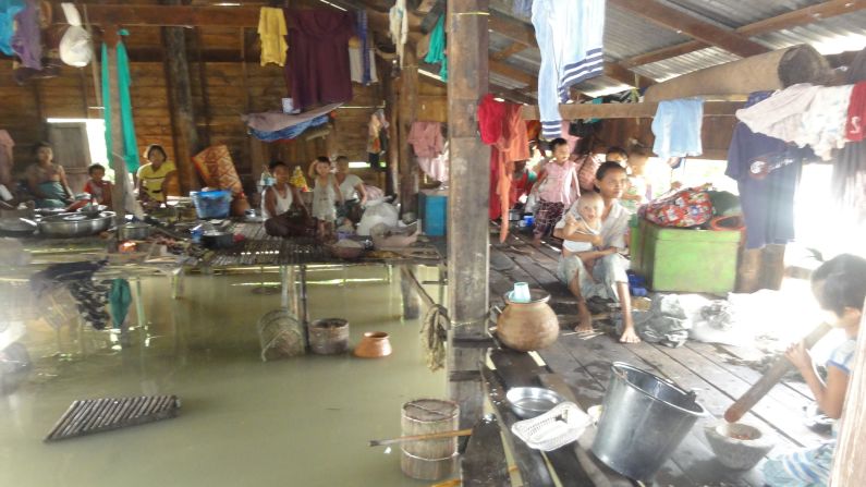 This photo taken last week by relief workers shows a family in Thabaung township in the Irrawaddy Delta  taking refuge from the flood waters.