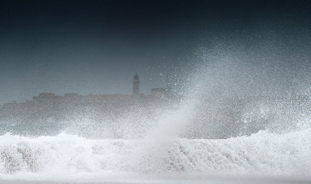 Waves batter the coast in Havana, Cuba, on Sunday after Tropical Storm Isaac passed the island.
