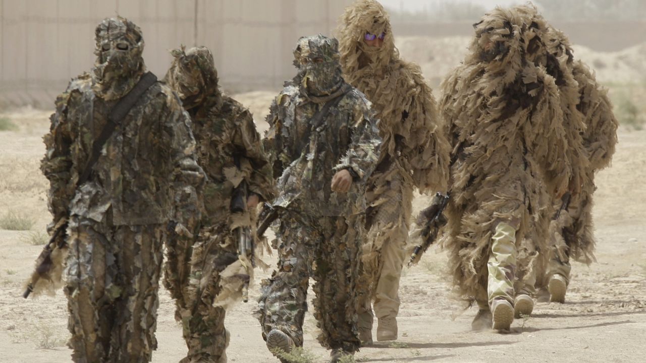 Ghillie suits -- camouflage outfits designed to resemble heavy foliage -- are worn by special operations soldiers in Iraq in 2009.