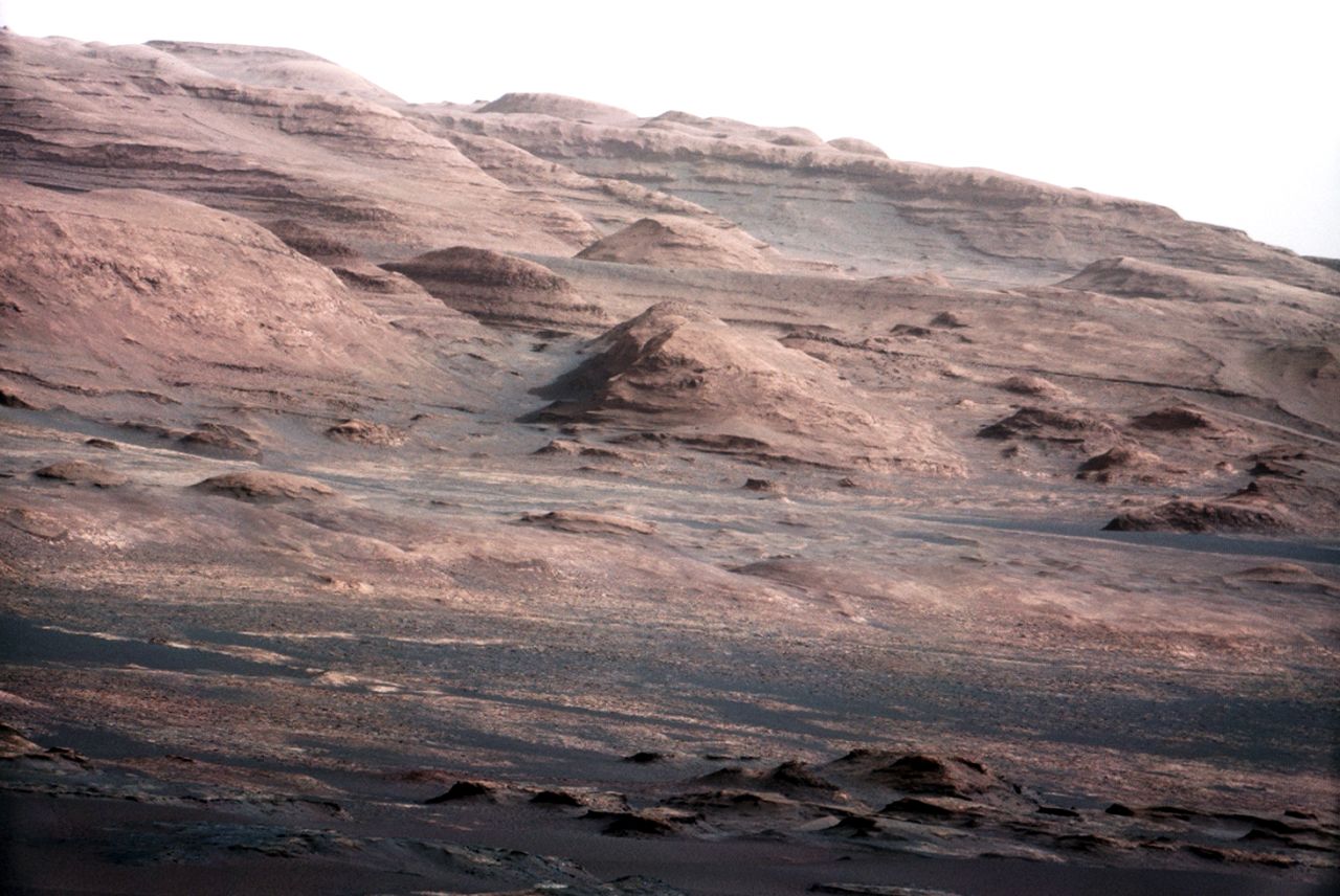 An image released August 27, 2012, was taken with Curiosity rover's 100-millimeter mast camera, NASA says. The image shows "Mount Sharp" on the Martian surface. NASA says the rover will go to this area. 