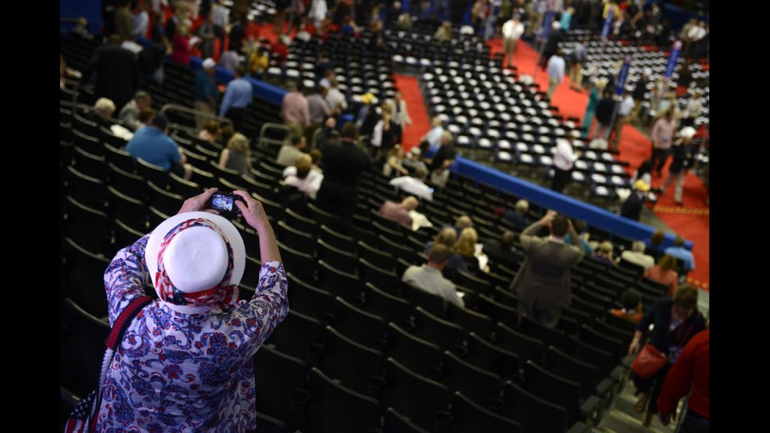 A delegate takes a picture of the floor at the Tampa Bay Times Forum.