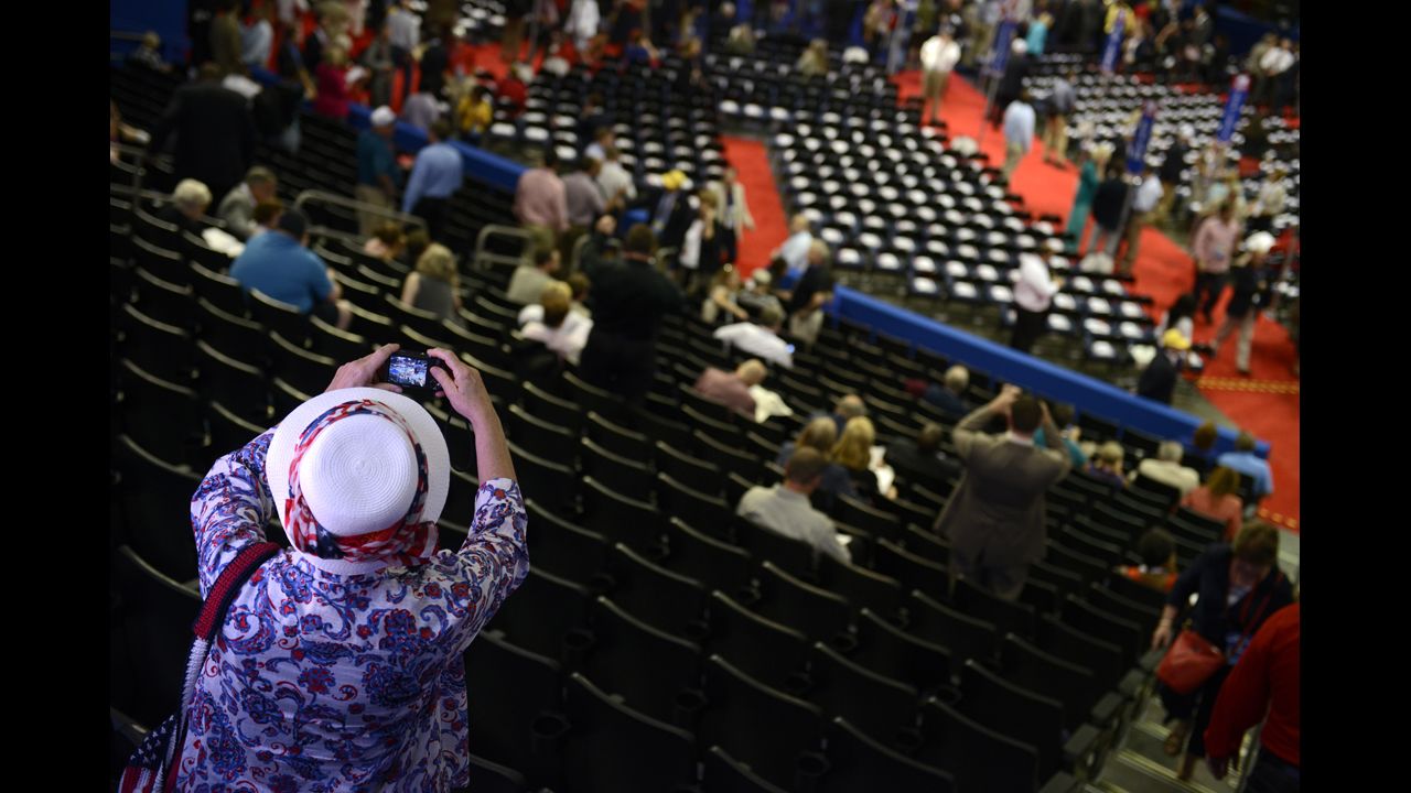 A delegate takes a picture of the floor at the Tampa Bay Times Forum.